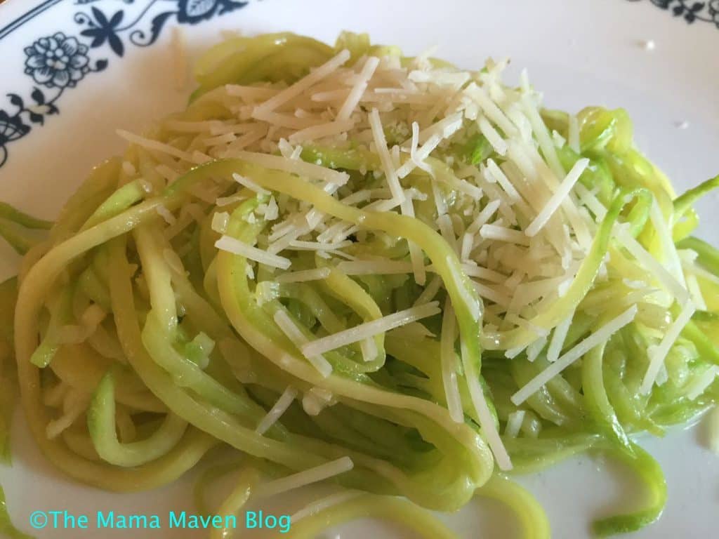 How to Make Zoodles AKA Zucchini Noodles with a Vegetable Spiralizer - top sauteed noodles with parmesan