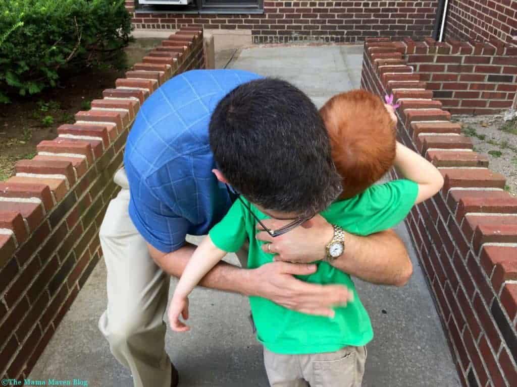 Getting a big hug from daddy.