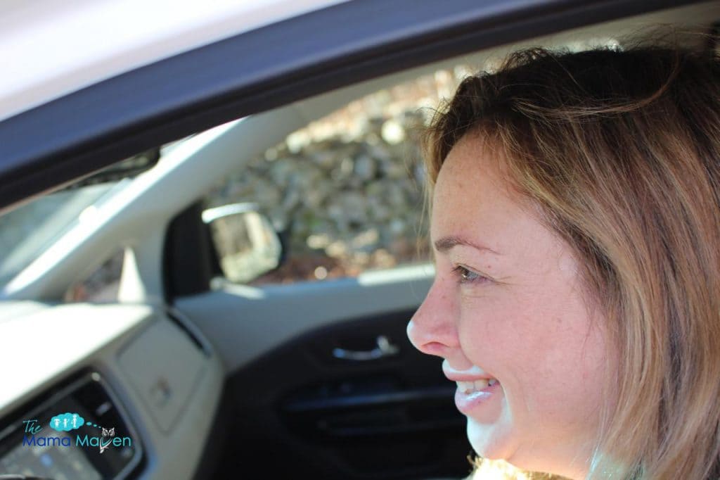 Nancy behind the wheel Kia Sedona Review for Family Travel | @themamamaven 