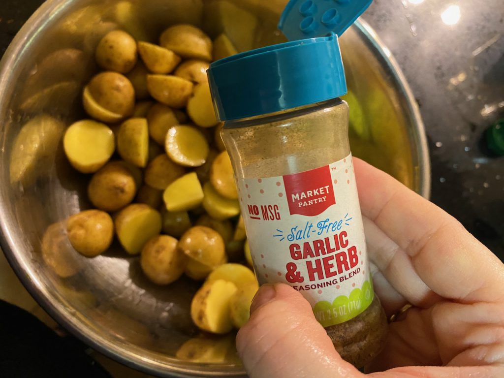 Adding spices to yukon gold potatoes