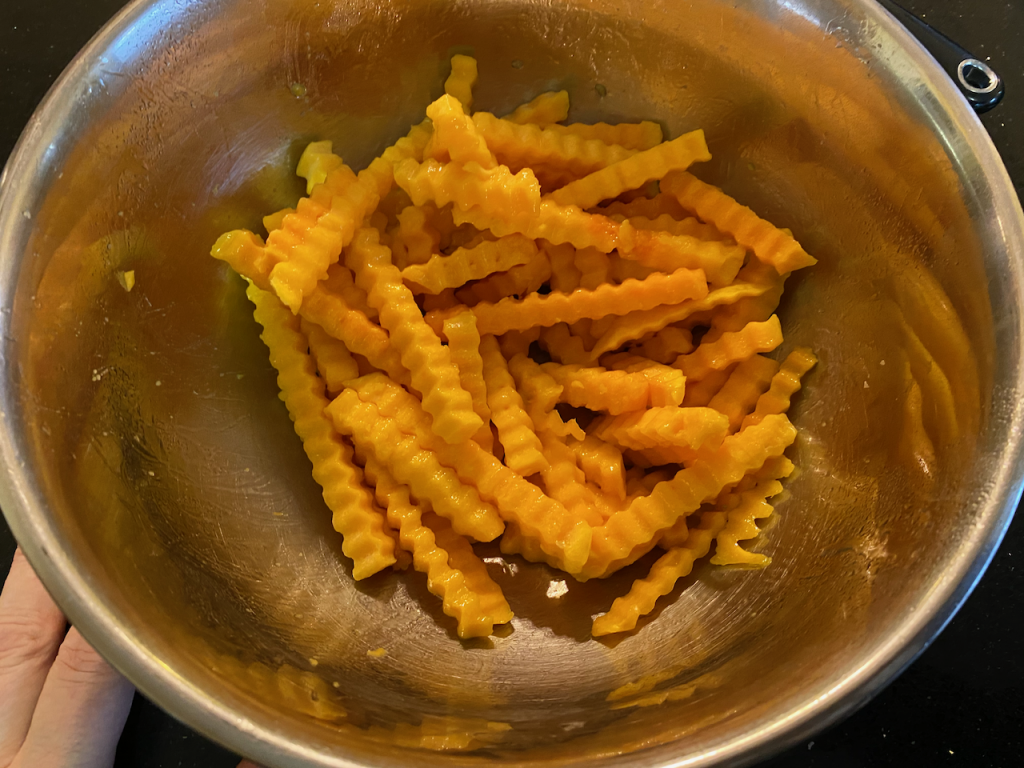 Fries coated with oil spray