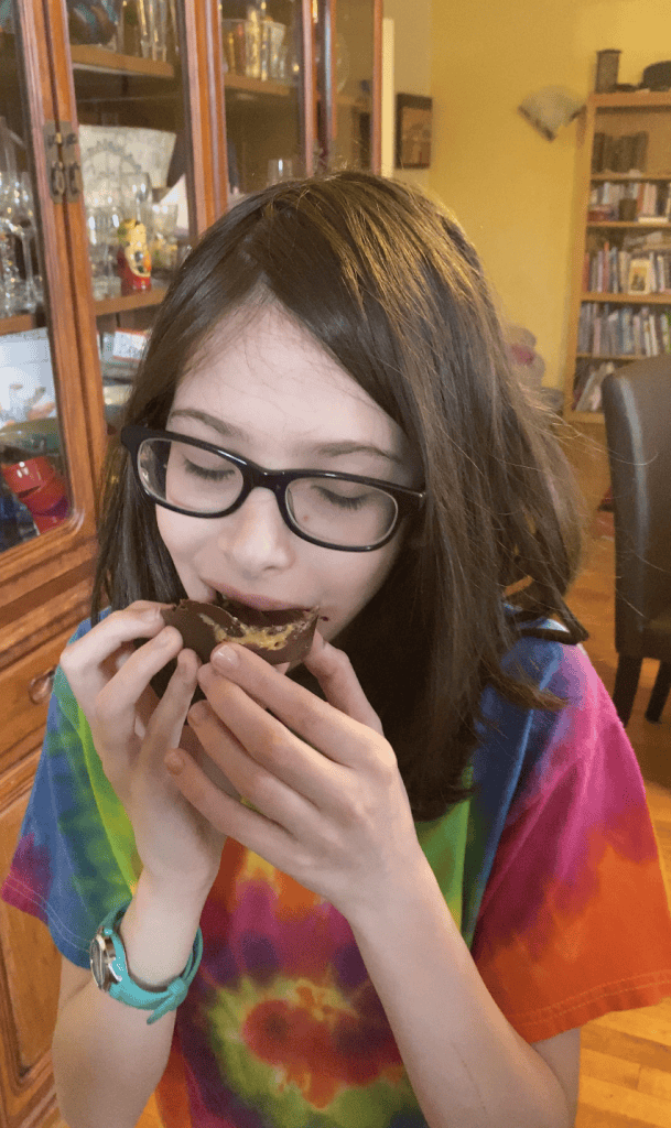 Enjoying a Chocolate Peanut Butter Cup | The Mama Maven Blog