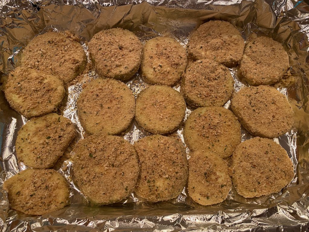 Breaded eggplant waiting to be baked