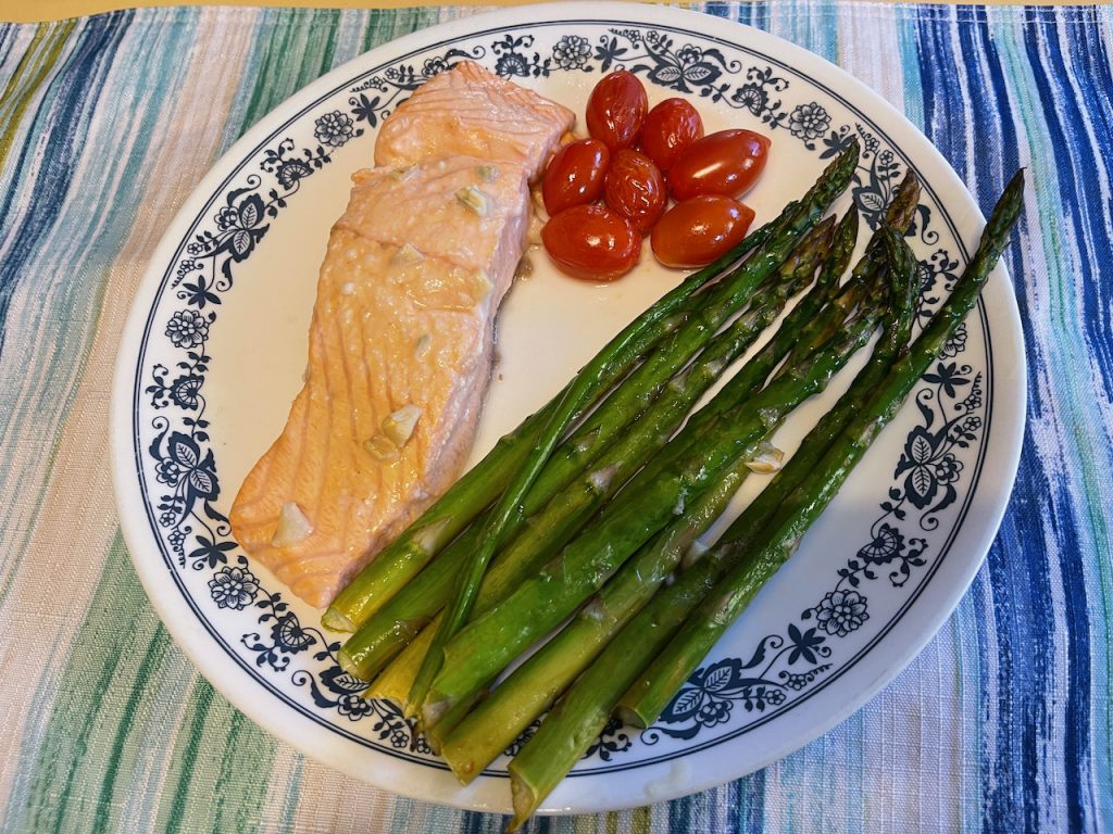 Sheet Pan Dinner: Garlic Lime Salmon Asparagus and Tomatoes on plate