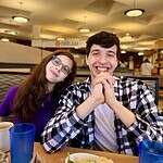 Shows 2 kids smiling