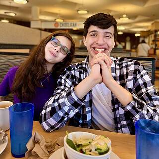 Shows 2 kids smiling